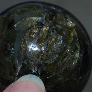 You are considering a beautiful labradorite sphere with a hematite 