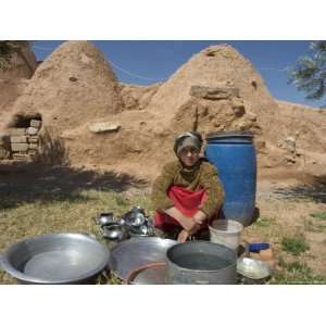  Local Woman Washing Dishes in Front of Beehive Houses 