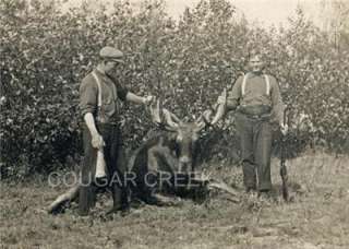   hunters with their bull moose vintage birch moose call and rifle wow