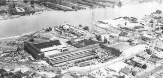 1950s   Aerial of Manufacturing property and buildings.