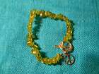 Peridot Bracelet with Peace Sign Charm at Closure Strung Stones 
