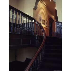  Elegant Staircase Leading to Arched Doorway Photographic 