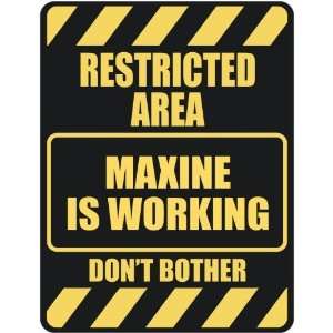  RESTRICTED AREA MAXINE IS WORKING  PARKING SIGN
