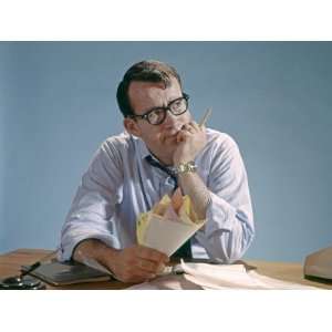 Worried Looking Man With Glasses at Desk Clutching Papers Photographic 