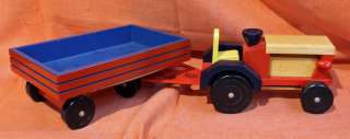   is a Wooden Hand Made Vintage Pull Toy Tractor Made in Romania