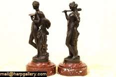   depicts a woman with a truncheon or club mounted on a red marble base