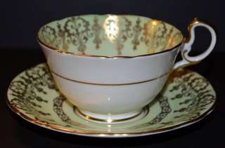 AYNSLEY GREEN GOLD FLORAL CENTER TEA CUP AND SAUCER ENGLAND ESTATE 