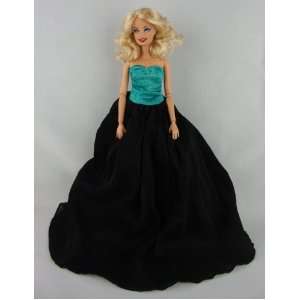  A Beautiful Black Gown with a Turquoise Botice Made to Fit 