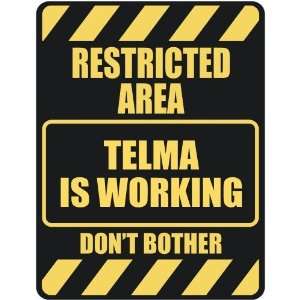   RESTRICTED AREA TELMA IS WORKING  PARKING SIGN