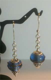 Examples of the chain earrings with a story bead on it.
