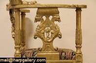 richly hand carved Victorian corner chair sports a cherub or angel 