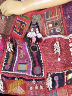   Mirrors, Metal beads, Cowrie Shells, beaded hangings and Hand