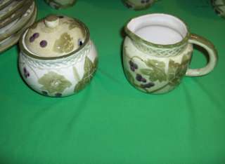   39 piece set of stoneware from Jay Imports in the pattern Grape Vine