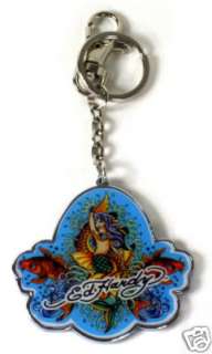 Mermaid tattoo print adorns the front of this keychain. Ed Hardy 