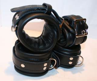 Wrist and ankle cuffs   shows padding, leather piping, locking buckle 