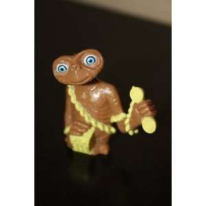The extra terrestrial Toy figure holding a Yellow Telephone E.T 