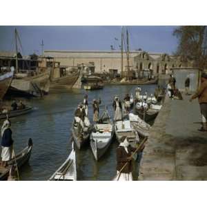  Men Pole Boats That are Shaped Liked Ancient River Craft 