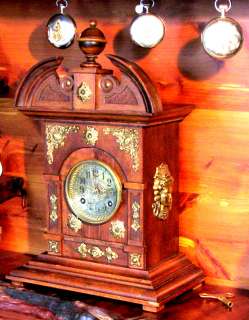 An 8 Day German Clock in a Solid Walnut Case With Brass  